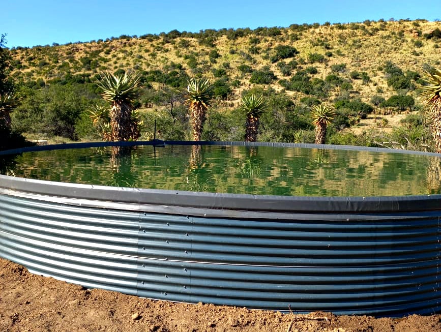eco dam installed on a farm, filled with water